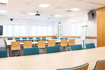 2 sets of tables and chairs set out in a square hollow